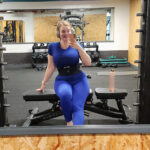 Why I Loved Dubai’s Women-Only Spaces Woman in blue workout clothes taking a mirror selfie inside a gym in Dubai.